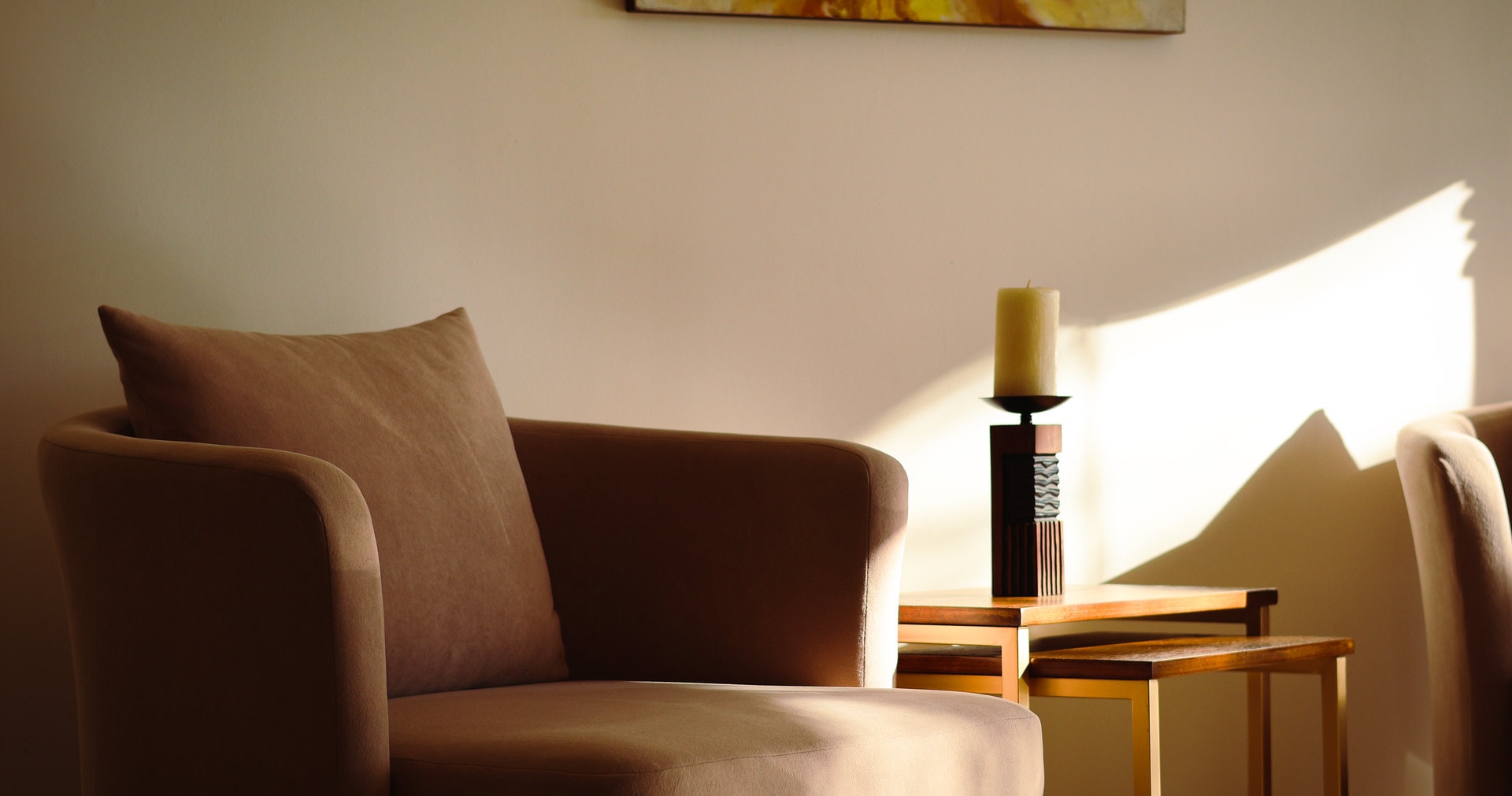 An armchair in a calm room in warm light