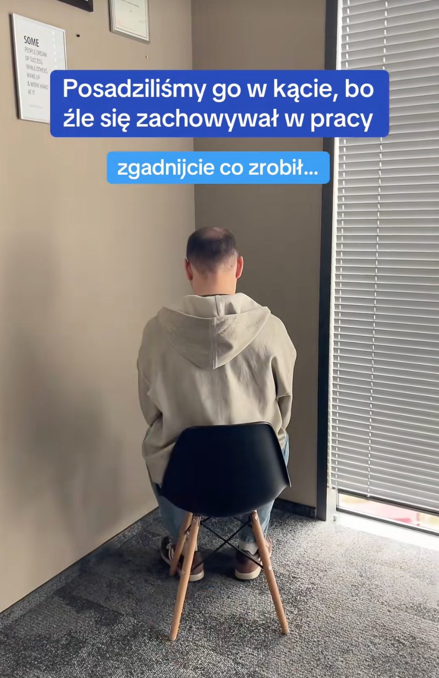 Kadr z filmu Pracuj.pl — osoba siedząca twarzą do kąta biura, napisy „Posadziliśmy go w kącie, bo źle się zachowywał w pracy” i „zgadnijcie co zrobił…”